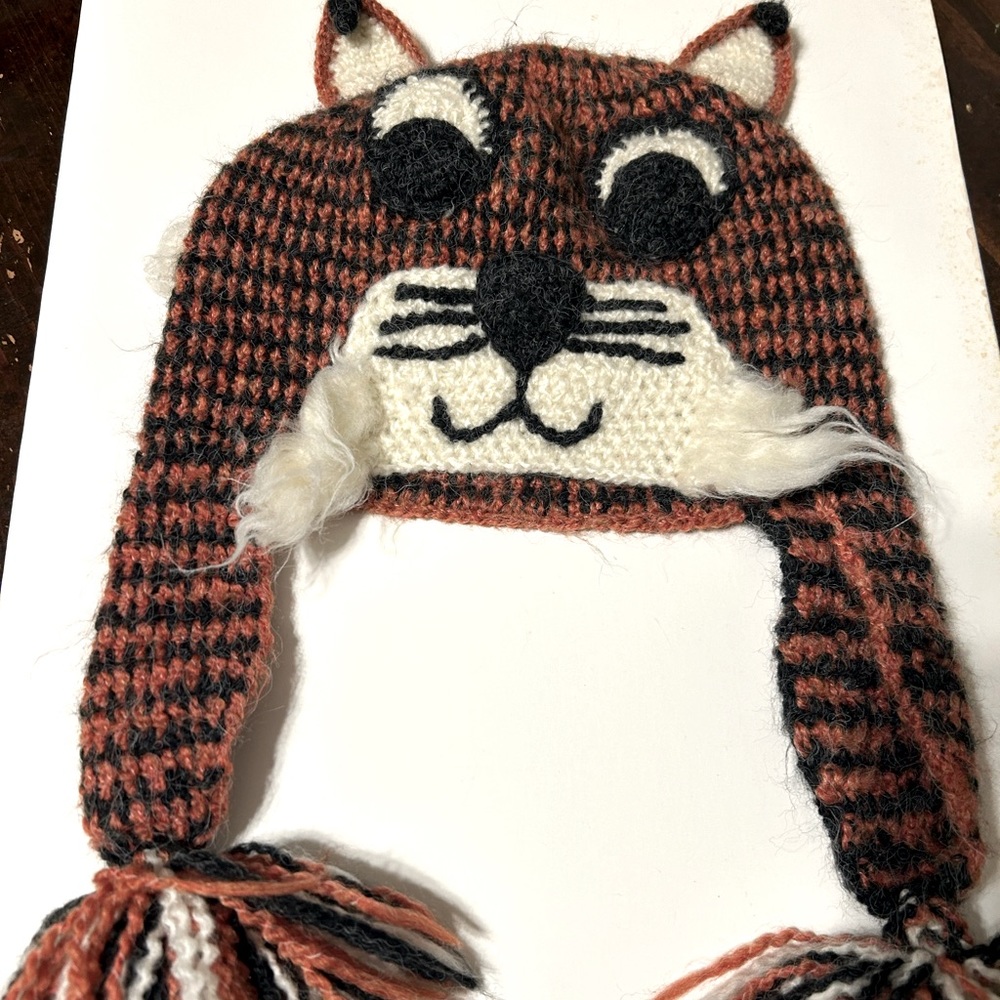 Tiger beanie with a darling small tail. Can fit adult head if small.